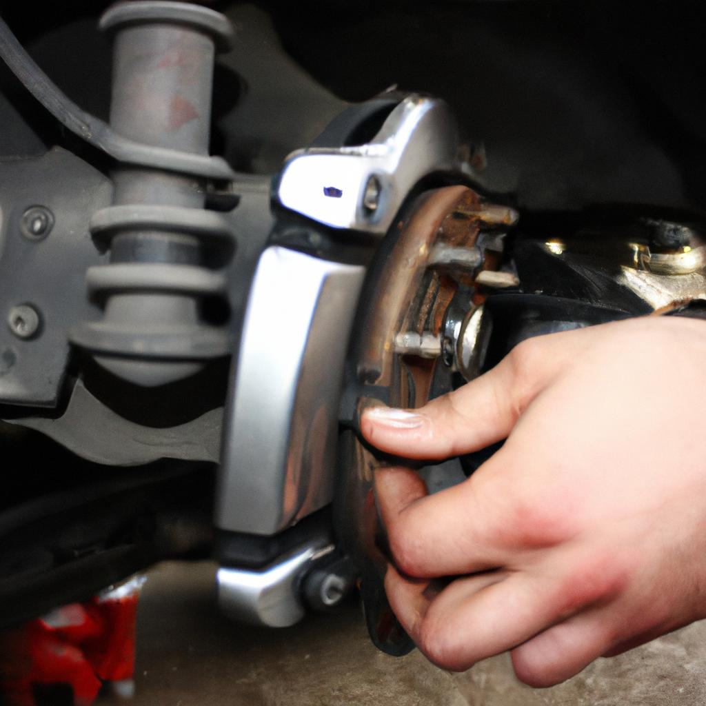Person inspecting car brake system