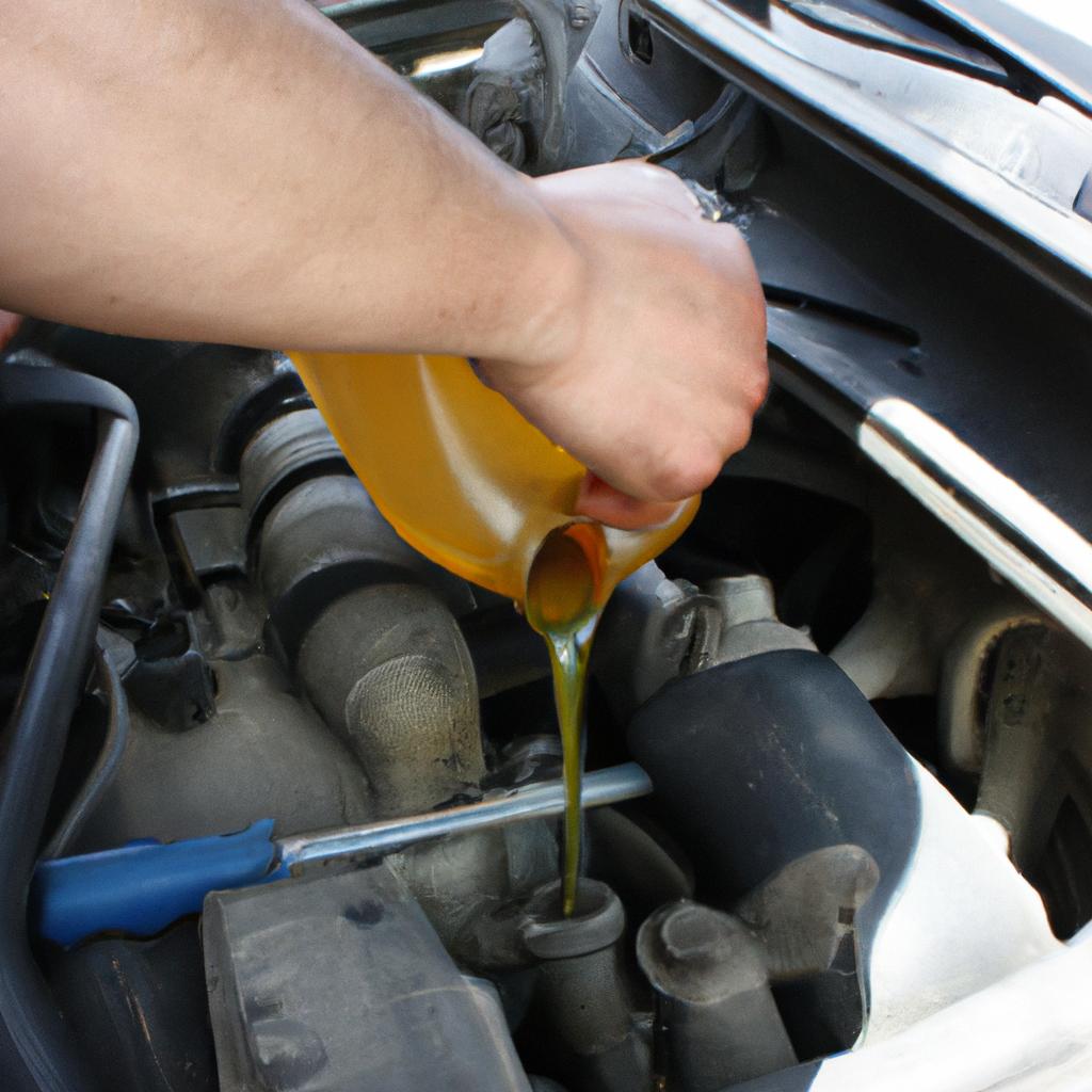 Person changing oil in vehicle